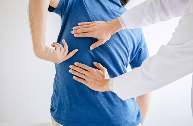 Physiotherapist providing manual therapy to a patient’s back